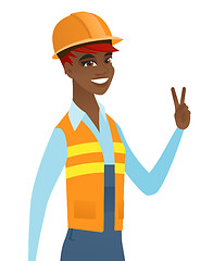 Image showing Young african builder showing victory gesture.