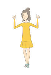 Image showing Young hippie woman standing with raised arms up.