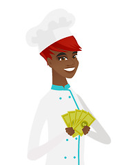 Image showing Young african-american chef holding money.