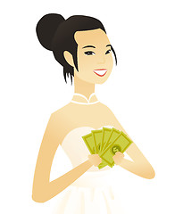 Image showing Young asian fiancee holding money.
