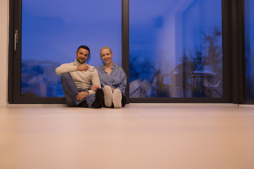 Image showing happy couple in front of fireplace