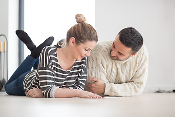 Image showing Young Couple using digital tablet on cold winter day