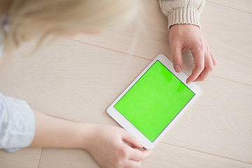 Image showing Young Couple using digital tablet on cold winter day