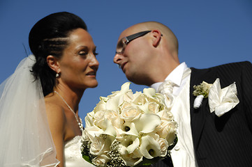Image showing Wedding flowers and couple