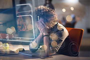 Image showing businessman relaxing at the desk