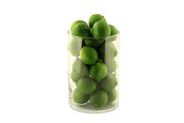 Image showing Key Limes in Glass Cylinder on white. 