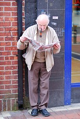 Image showing A stoutsman with his paper.