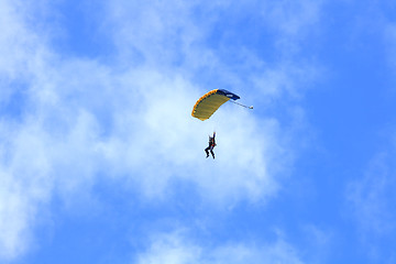 Image showing Skydiver parachuting down to the Earth. 