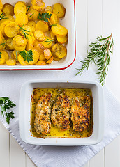 Image showing Chicken parmigiana - parmesan chicken with baked potatos 