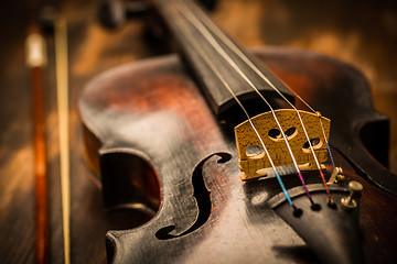 Image showing Detail of old violin and bow in vintage style