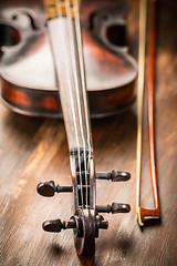 Image showing Detail of old violin and bow in vintage style