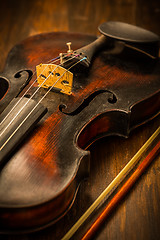 Image showing Detail of old violin and bow in vintage style