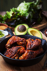 Image showing Grilled hot and spicy chicken wings with guacamole