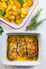 Image showing Chicken parmigiana - parmesan chicken with baked potatos 