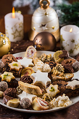 Image showing Assorted Christmas cookies with candles on the table