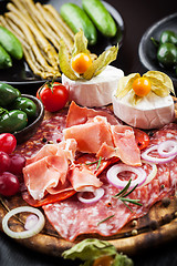 Image showing Serrano ham platter with variation of appetizers