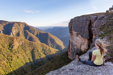 Image showing Woman takiong in beautiful mountain views from cliff top lookout