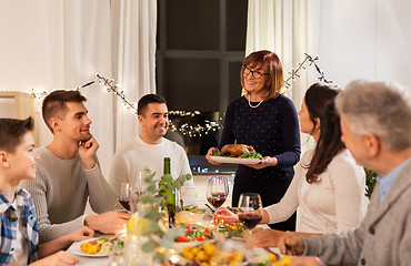 Image showing happy family having dinner party at home