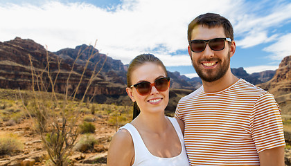 Image showing couple in sunglasses in summer over grand canyon