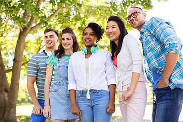 Image showing happy international friends in park