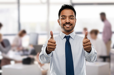 Image showing indian businessman showing thumbs up at office