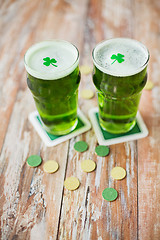 Image showing glasses of green beer with shamrock and gold coins