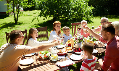 Image showing happy family having dinner or summer garden party