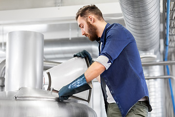 Image showing man working at craft brewery or beer plant