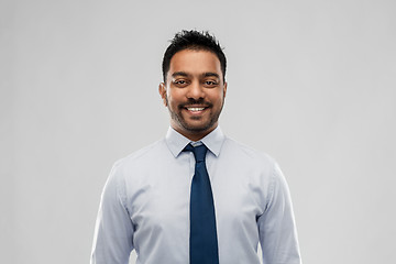 Image showing indian businessman in shirt with tie over grey