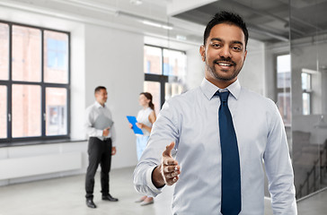 Image showing businessman or realtor giving hand for handshake