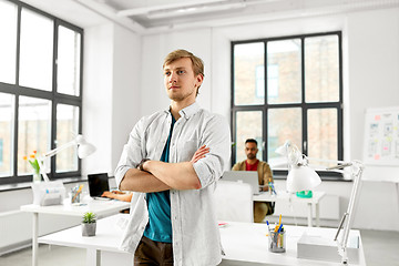 Image showing man with crossed hands at office