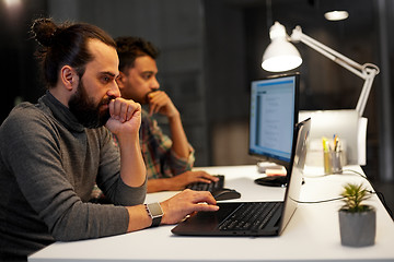 Image showing creative team with computer working late at office