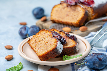 Image showing Slices of traditional plum cake on ceramic plate.