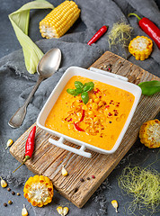 Image showing Creamy corn soup with chili in a white bowl.