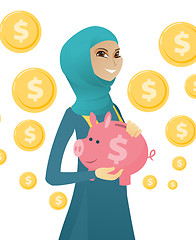 Image showing Young muslim business woman holding a piggy bank.