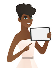 Image showing Young african fiancee holding tablet computer.