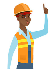 Image showing African builder with open mouth pointing finger up