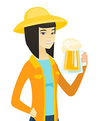 Image showing Young asian farmer drinking beer.