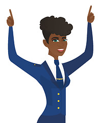 Image showing African stewardess standing with raised arms up.