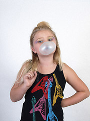 Image showing Young Girl Blowing a Bubble