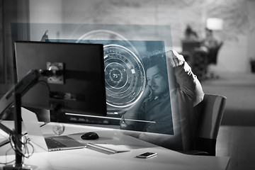 Image showing businessman relaxing at the desk