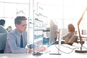 Image showing businessman working using a computer in startup office