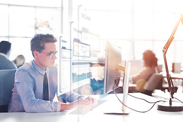 Image showing businessman working using a computer in startup office