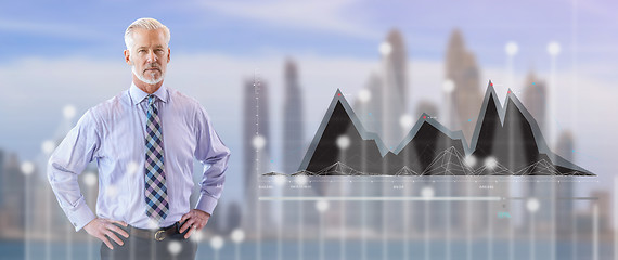 Image showing Senior businessman in front of the big city