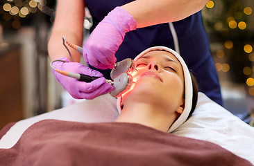 Image showing young woman having face microdermabrasion at spa