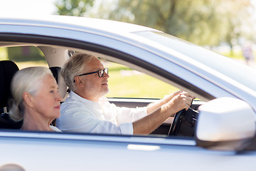 Image showing happy senior couple driving in car