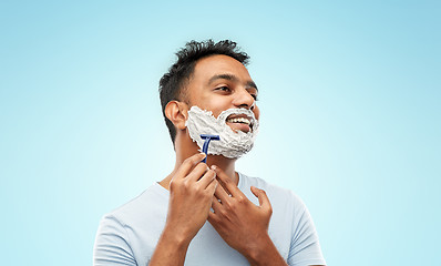 Image showing indian man shaving beard with razor blade