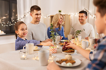 Image showing happy family having tea party at home