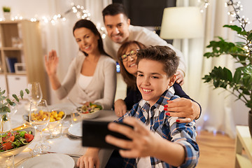 Image showing family having dinner party and taking selfie