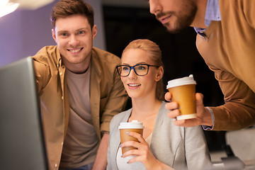 Image showing business team with coffee working at night office